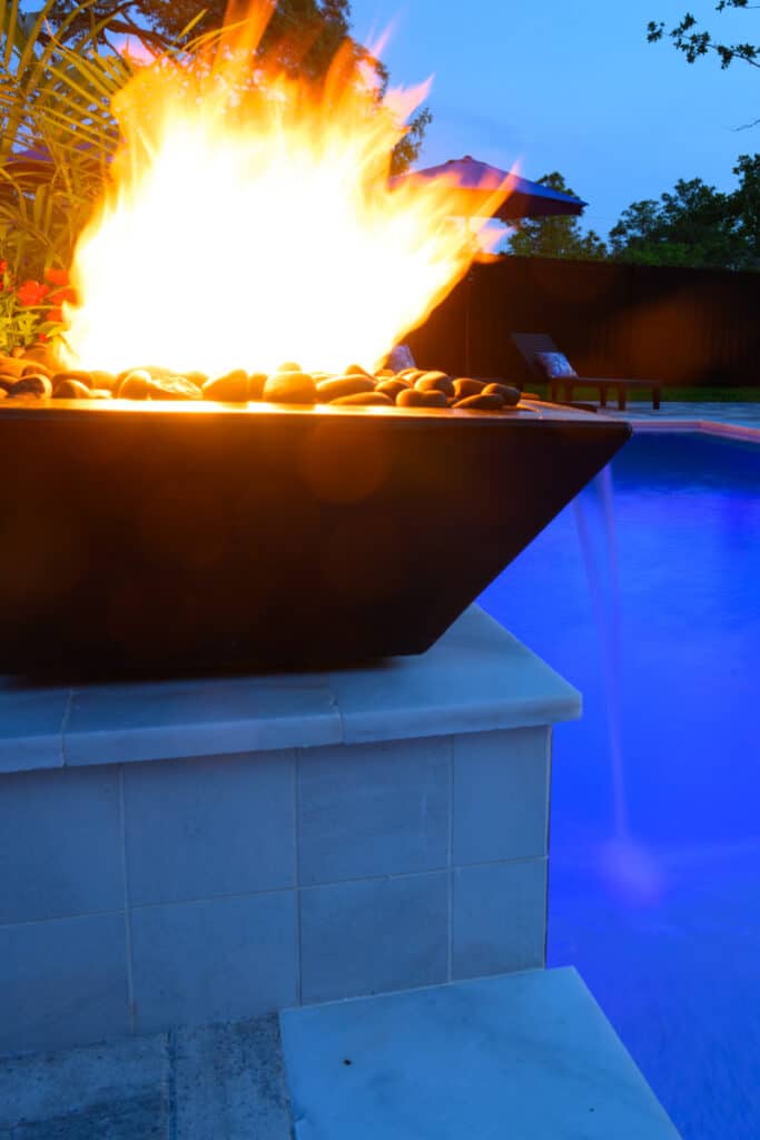 Black fire water bowl placed at the pool's edge