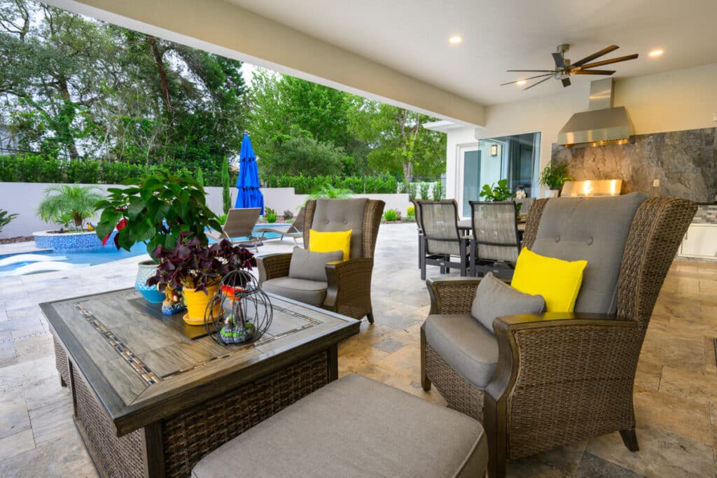 Cozy outdoor seating area with wicker furniture and bright yellow cushions in Weeki Wachee