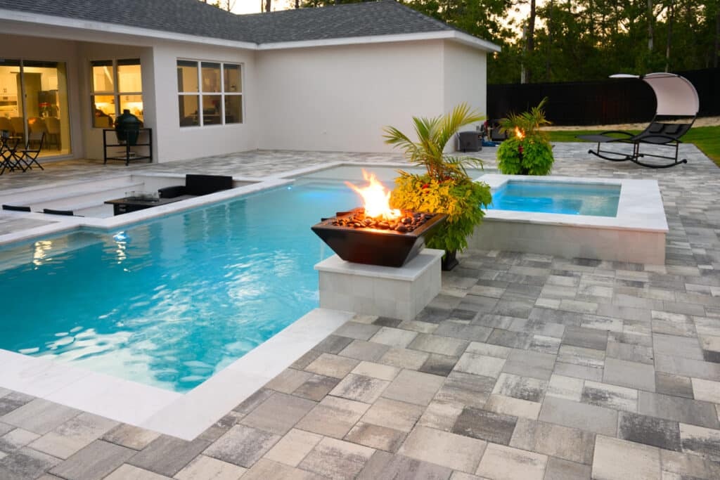 Fire water bowl and seating area, offering a warm and inviting poolside experience in Weeki Wachee, FL.