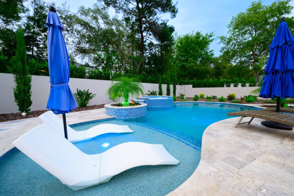 Lounge chairs on sun shelf in Weeki Wachee backyard pool