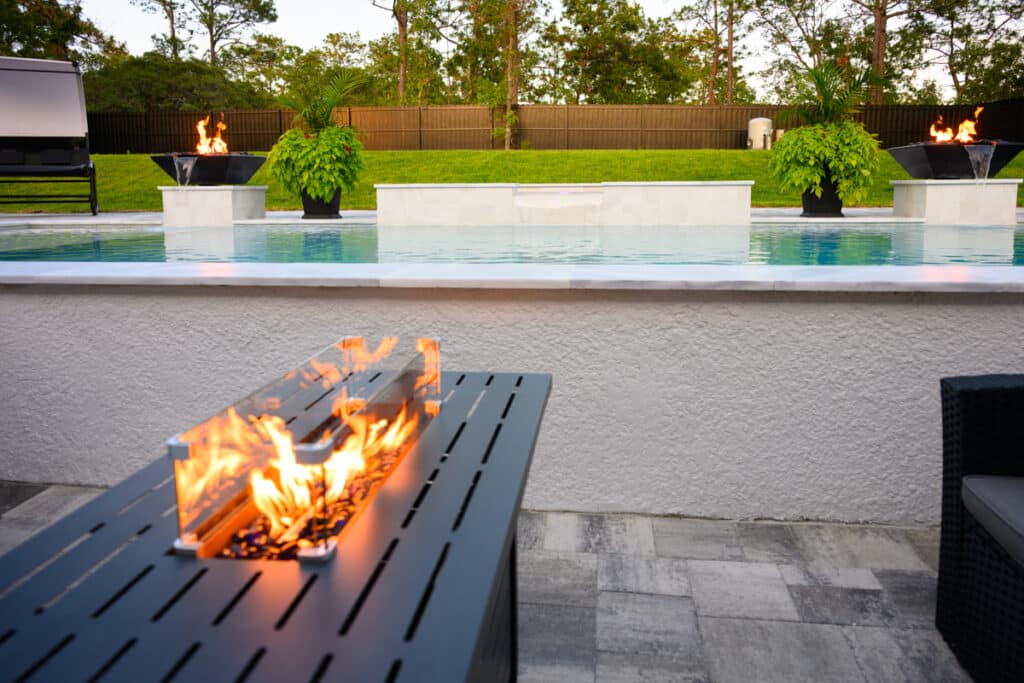 Poolside view featuring a firepit