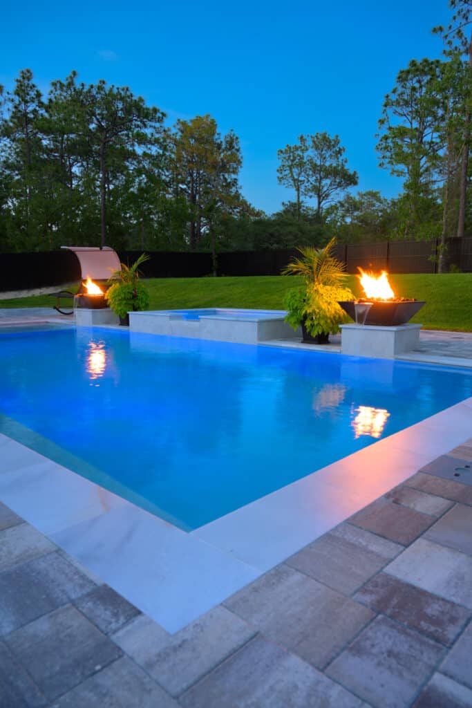 Poolside view with a fire water bowl, showcasing a harmonious blend of fire and water elements.