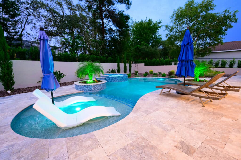 Serene Weeki Wachee backyard pool with lounge chairs in the sun shelf