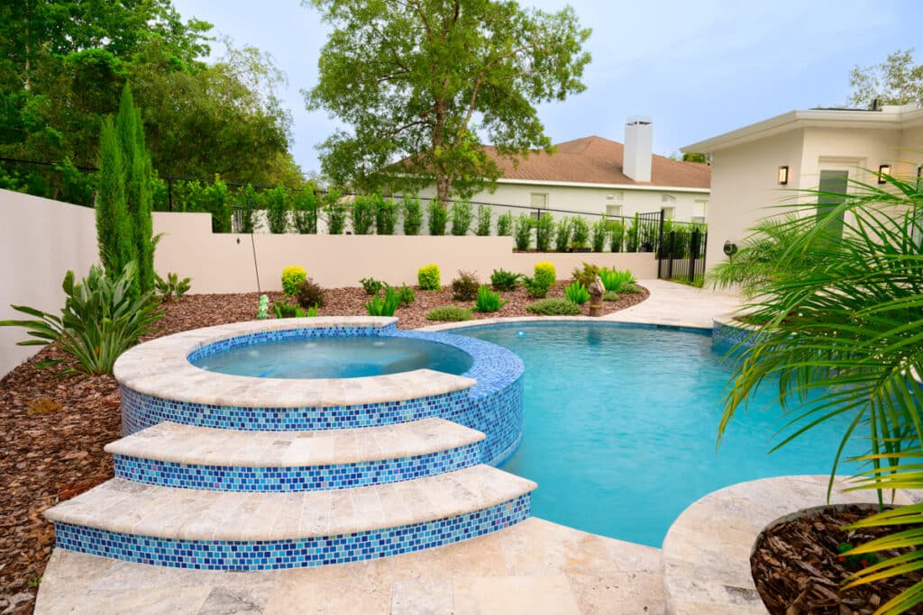 Stylish backyard pool with cascading steps in Weeki Wachee Fl