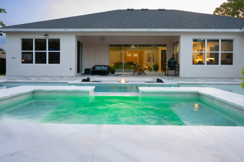 Wide view of a modern pool with clean lines and clear water