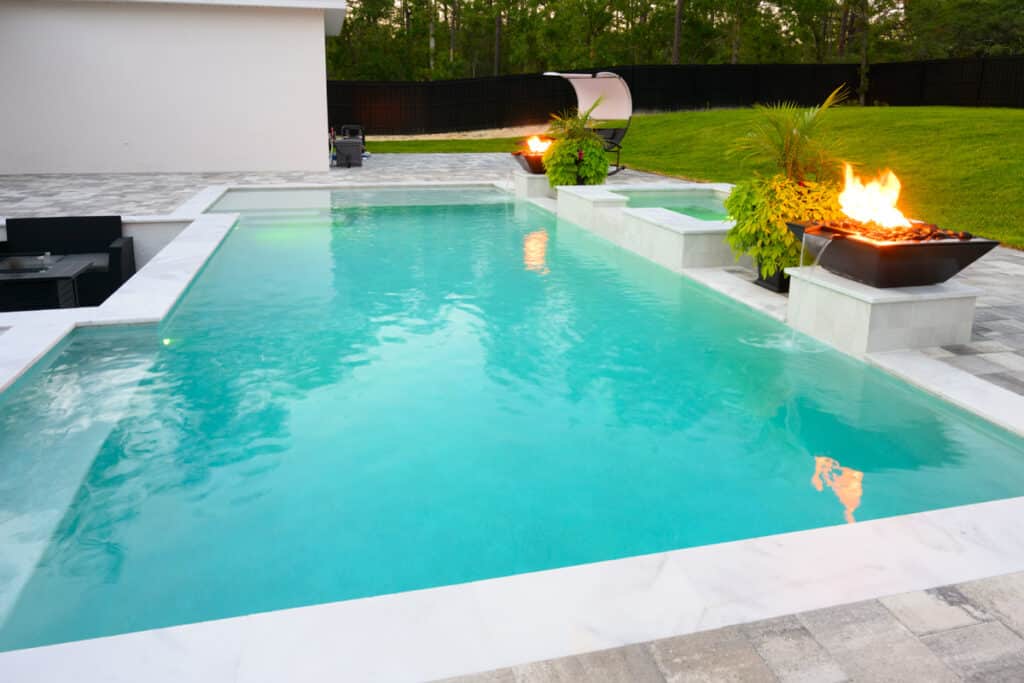 view of rectangular pool with firebowls