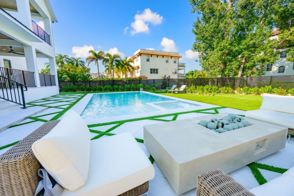 Close-up of lush greenery surrounding the poolside area.