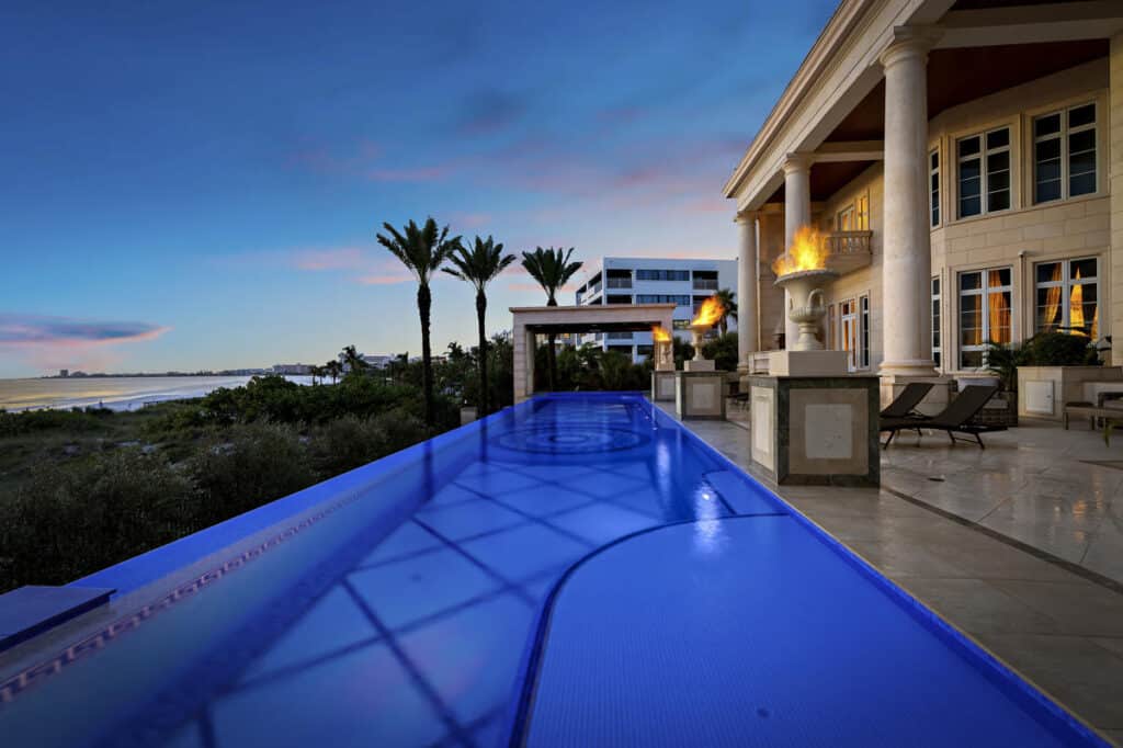 Infinity pool in Tampa with breathtaking ocean views, creating a serene setting for relaxation and leisure.