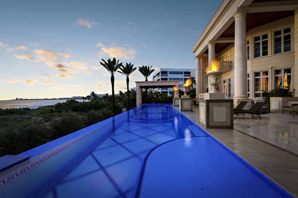 Luxury pool in Tampa with glowing LED lights and a seamless edge, perfect for creating an evening ambiance in your backyard.