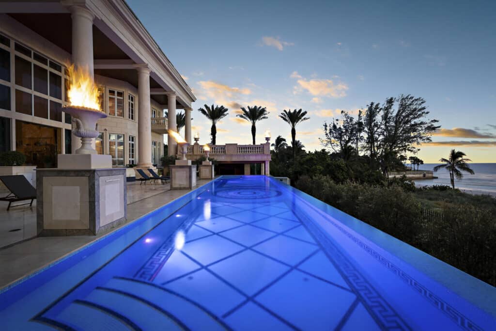 Luxury pool in Tampa with sheltered lounge area and LED lights, providing a private escape with a modern touch.