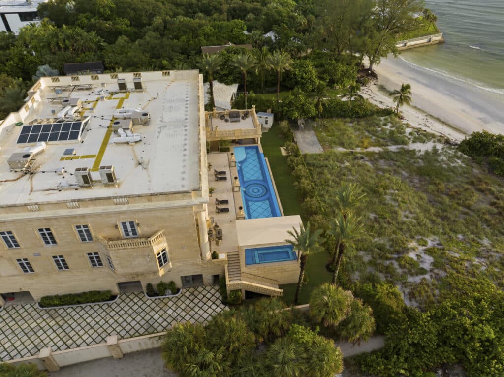 Overhead shot of a luxury pool in Tampa with large water features and expansive sundeck ideal for backyard entertainment