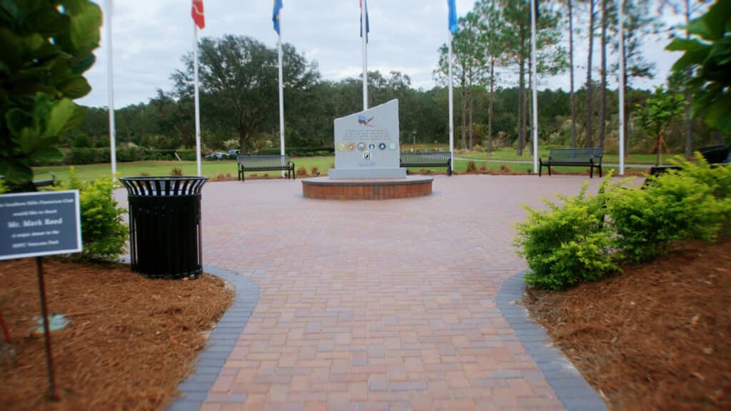 Overview of the Southern Hills Veterans Memorial, showcasing elegant pavers and the custom monument by Nic's Pool Construction.