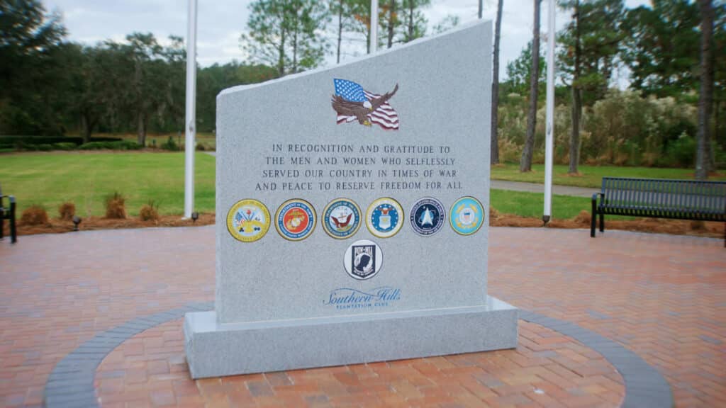 Southern Hills Veterans Memorial monument featuring custom engravings and elegant paver design by Nic's Pool Construction.